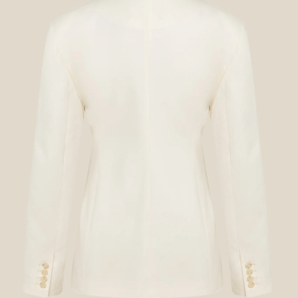 Бяло дамско сако о дънкови бял памучен плат с деконструирана кройка, странично закопчаване и джоб отпред от теадоре