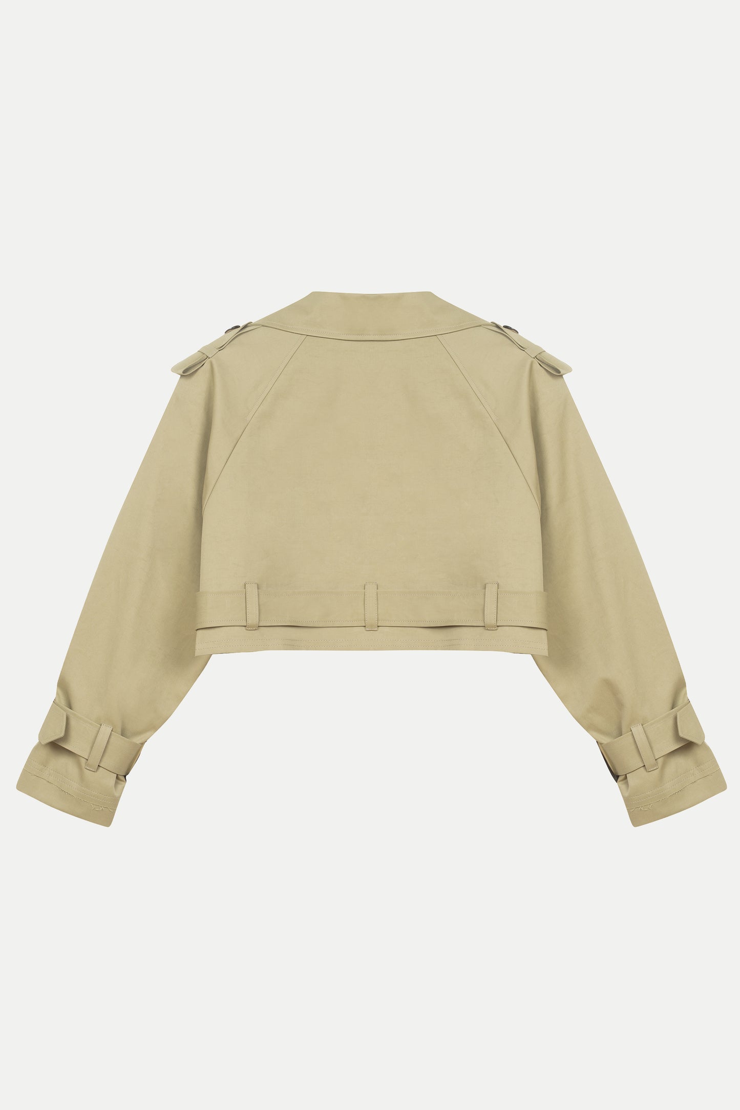 Back view of luxury women’s beige cotton trench coat – Arina cropped design with premium outerwear details