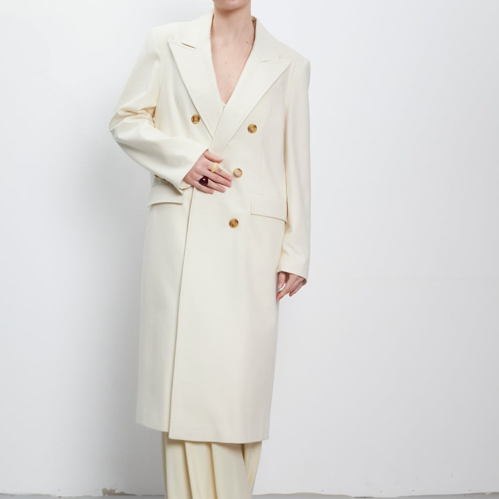 
                  
                    Double-breasted wool and alpaca coat in milky white on bulgarian designer Teadore P
                  
                
