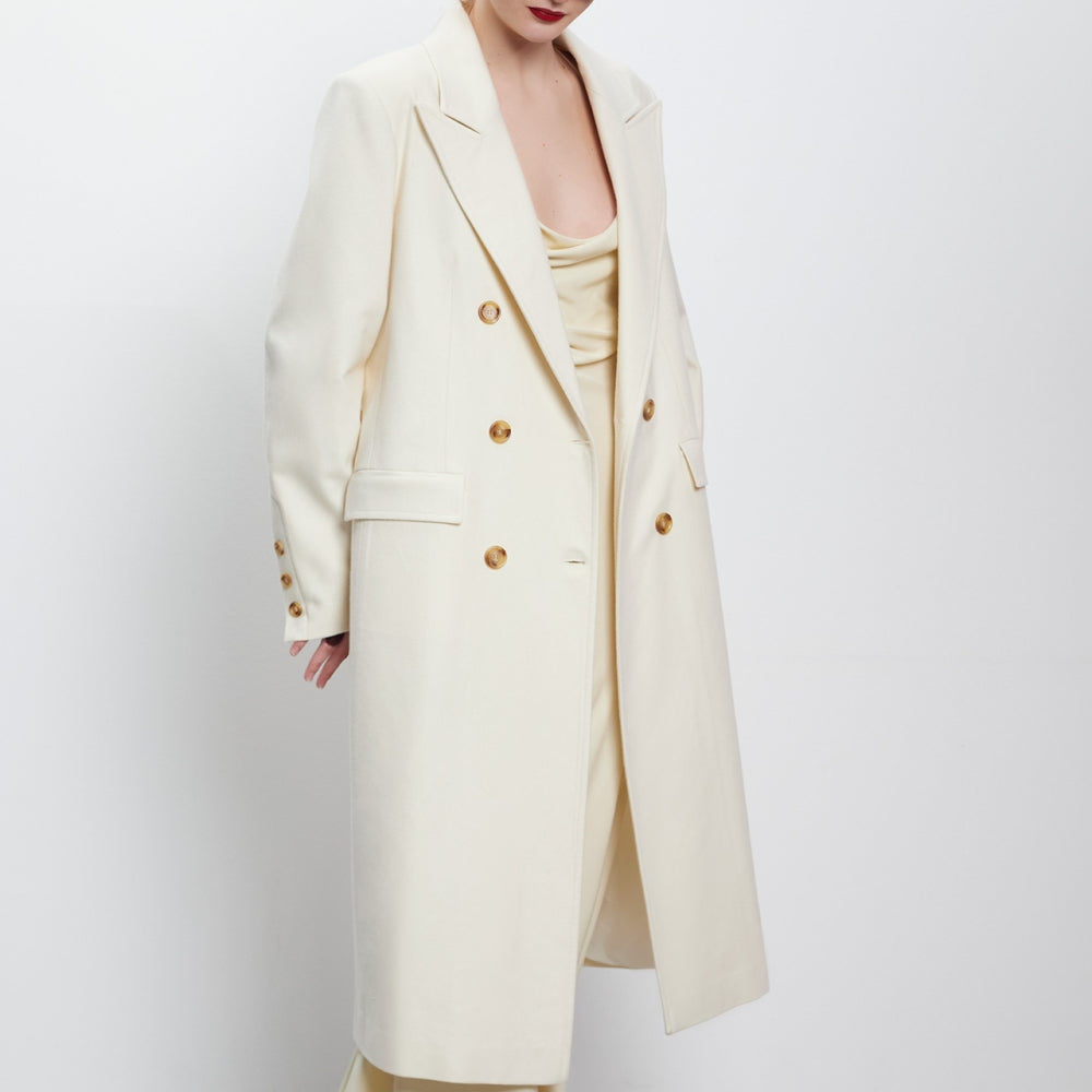 
                  
                    Double-breasted wool and alpaca coat in milky white on bulgarian designer Teadore P
                  
                